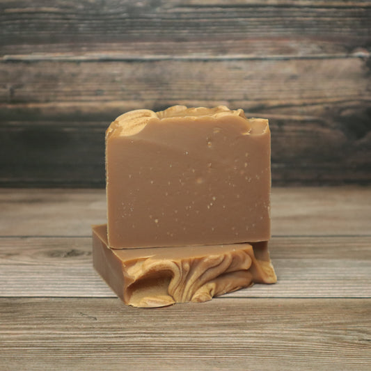 picture of soap that is solid brown with swirls on top for decoration 