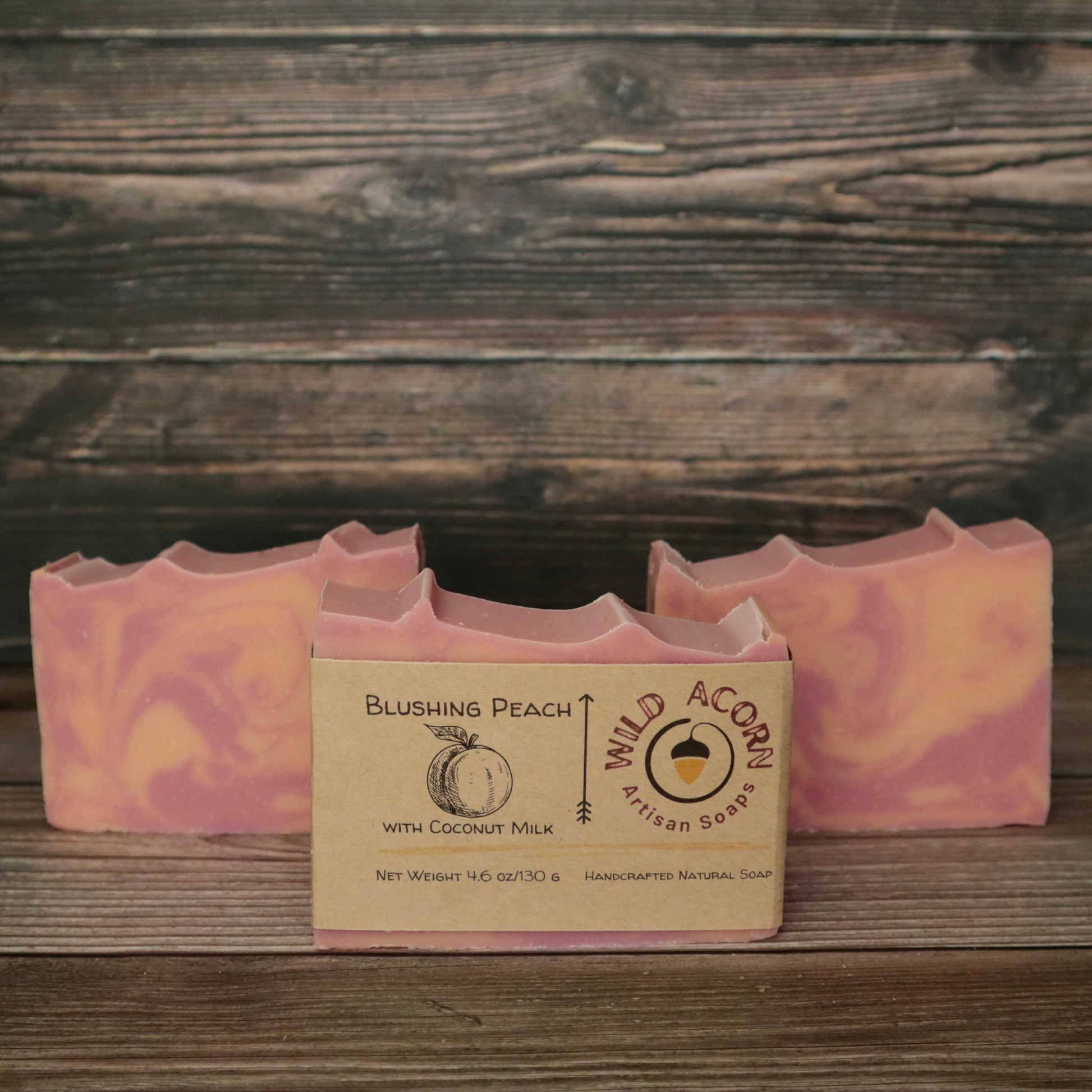 picture of soap with pink and peach colored swirls with slight ridges on top for detail