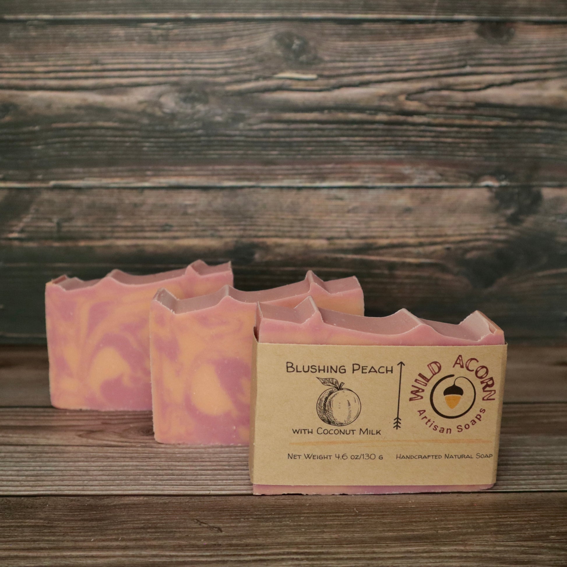 picture of soap with pink and peach colored swirls with slight ridges on top for detail