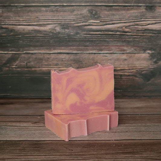 picture of soap with pink and peach colored swirls with slight ridges on top for detail