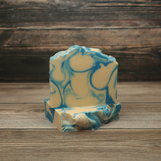 Two bars of soap with dark blue, light blue and white swirls.
