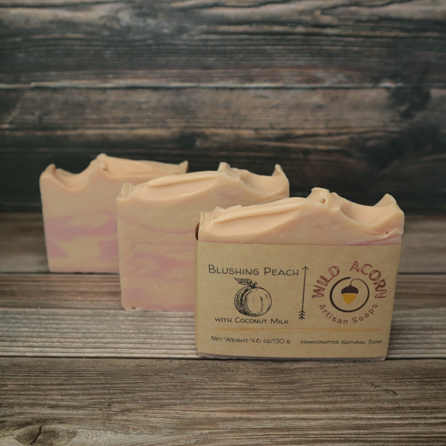 picture of soap with pink and light pink/peach colored swirls 